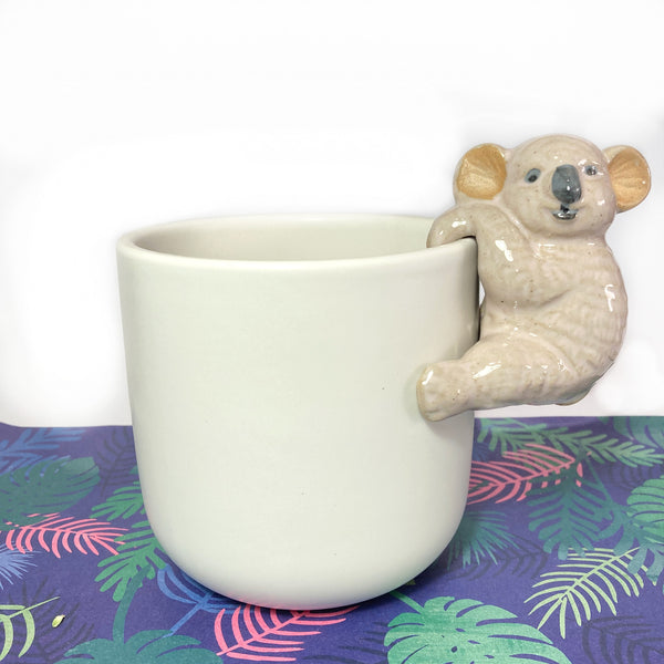 White pot with ceramic animal
