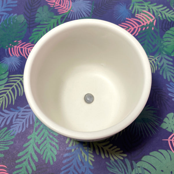 White pot with ceramic animal