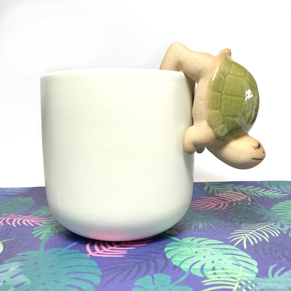 White pot with ceramic animal